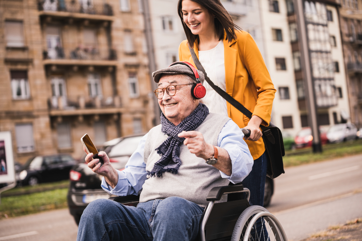laughing-young-woman-pushing-happy-senior-man-with-2024-09-19-10-55-52-utc